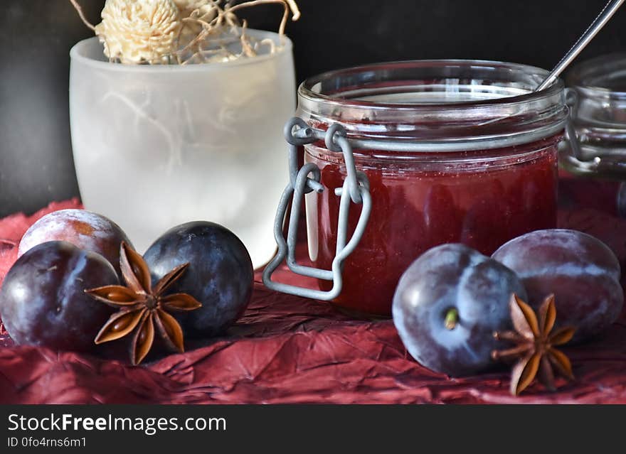 Round Fruit Near Mason Glass Jar