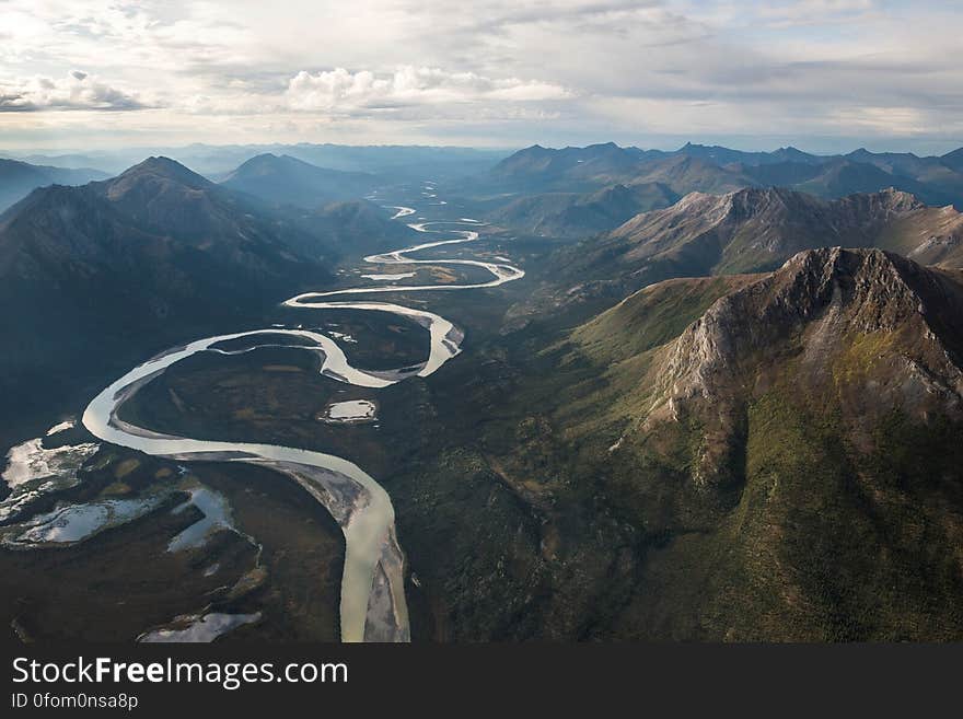 Green Mountains and Flowing River