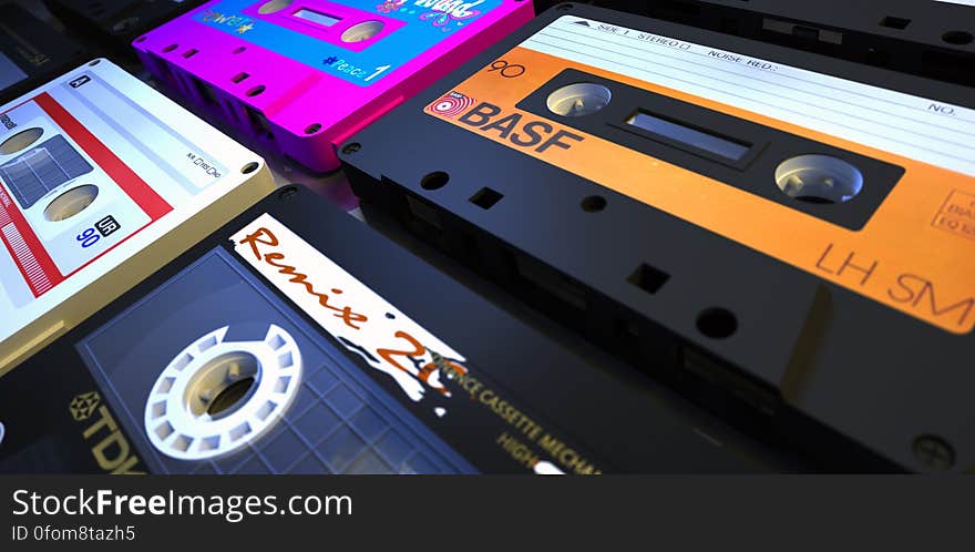 Old audio cassette tapes on table.