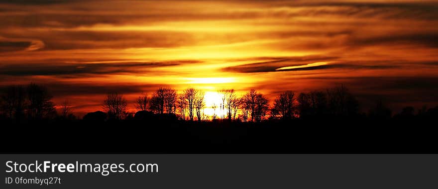 Scenic View of Silhouette Landscape Against Sunset Sky