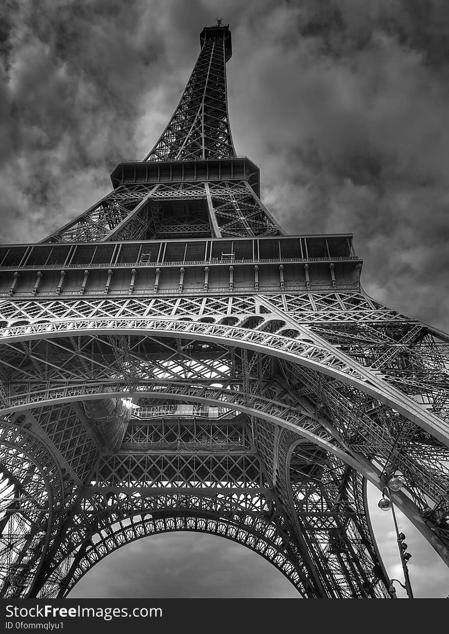 A black and white low angle perspective of the Eiffel Tower, Paris, France.