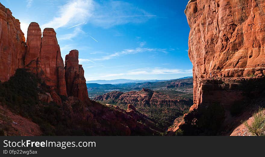 View from the saddle on Cathedral Rock. Cathedral Rock Trail ascends one of the most recognizable rock formations in the heart of Red Rock Country. Many visitors hike the first quarter mile to enjoy the fantastic views from the first ledge, where the trail meets Templeton Trail. From here, the trail becomes as much a rock climb as a hike, requiring non-technical scrambling up rock faces and ledges to make it to the final ascent to the top. The saddle between two spires offers spectacular views. The unmaintained trail explores the lava and spires at the top. Photo by Deborah Lee Soltesz, January 12, 2011. Credit: USFS Coconino National Forest. Learn more about hiking Cathedral Rock Trail No. 170 in the Red Rock Ranger District of the Coconino National Forest website.