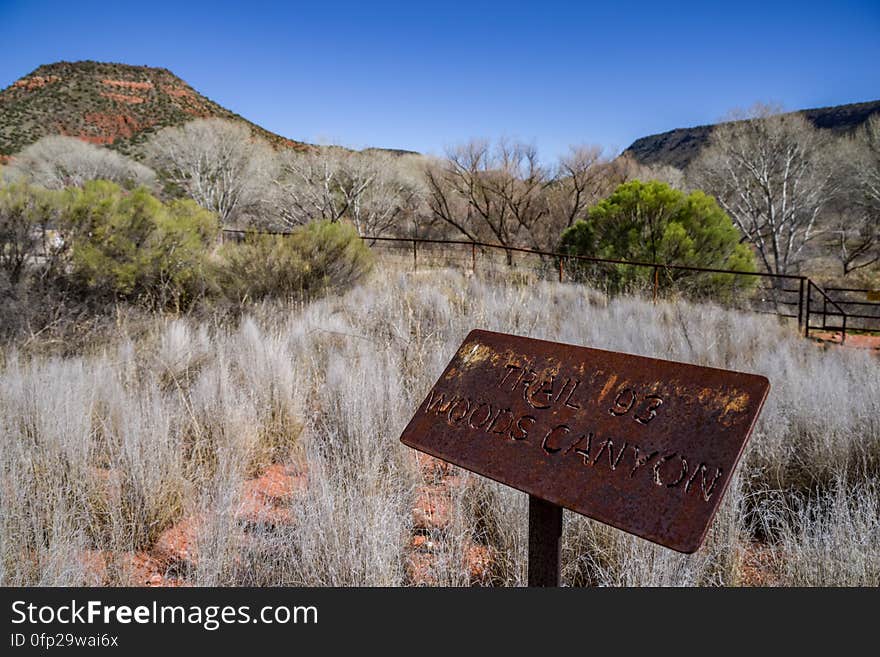 Snowmelt from a series winter storms in late January 2017 followed by rain and warm weather in February had dry creekbeds running and many of Arizona&#x27;s reservoirs filled and overflowing. Dry Beaver Creek in Woods Canyon was no exception. Woods Canyon Trail is level and unshaded as it follows a jeep road into the wide canyon mouth for 1.25 miles. The road ends and the trail continues, climbing gradually. There are views of the vegetation-covered slopes of mesas on either side. The trail enters Munds Mountain Wilderness continuing its easy climb. The trail approaches and then follows Dry Beaver Creek. At the confluence with Rattlesnake Canyon, the trail emerges onto a picturesque expanse of redrock studded with huge, gray boulders. Further down some nice redrock views as the trail climbs on a moderate grade out of the creekbed. Photo by Deborah Lee Soltesz, February 15, 2017. Credit: Coconino National Forest, U.S. Forest Service. Learn more about Woods Canyon Trail No. 93 on the Coconino National Forest.