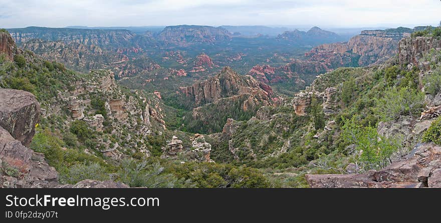 Little Round Mountain &#x28;panorama&#x29;. We headed out of Flagstaff down Woody Mountain Road for a week of camping and day hiking around the Rattlesnake Mesa area. The area is north of Sedona&#x27;s Secret Canyon, on top of the Mogollon Rim. There are several trails, mostly unmaintained, heading along or off the edge of the Rim. For the first day&#x27;s hike, we headed for FS Trail #9, which heads across Little Round Mountain and along the Rim around South Pocket... Read the blog entry for this hike