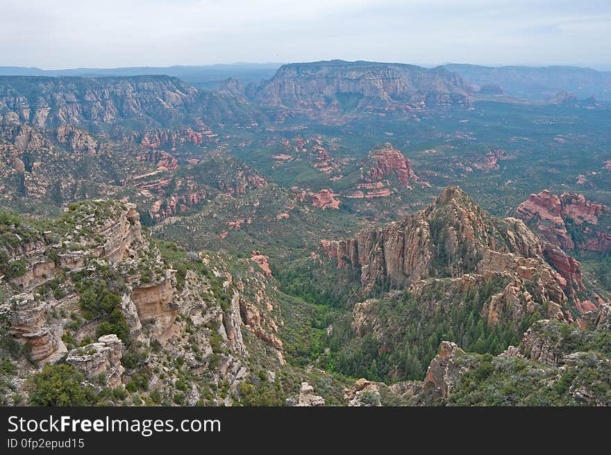 View into Secret Canyon from Little Round Mountain. We headed out of Flagstaff down Woody Mountain Road for a week of camping and day hiking around the Rattlesnake Mesa area. The area is north of Sedona&#x27;s Secret Canyon, on top of the Mogollon Rim. There are several trails, mostly unmaintained, heading along or off the edge of the Rim. For the first day&#x27;s hike, we headed for FS Trail #9, which heads across Little Round Mountain and along the Rim around South Pocket... Read the blog entry for this hike