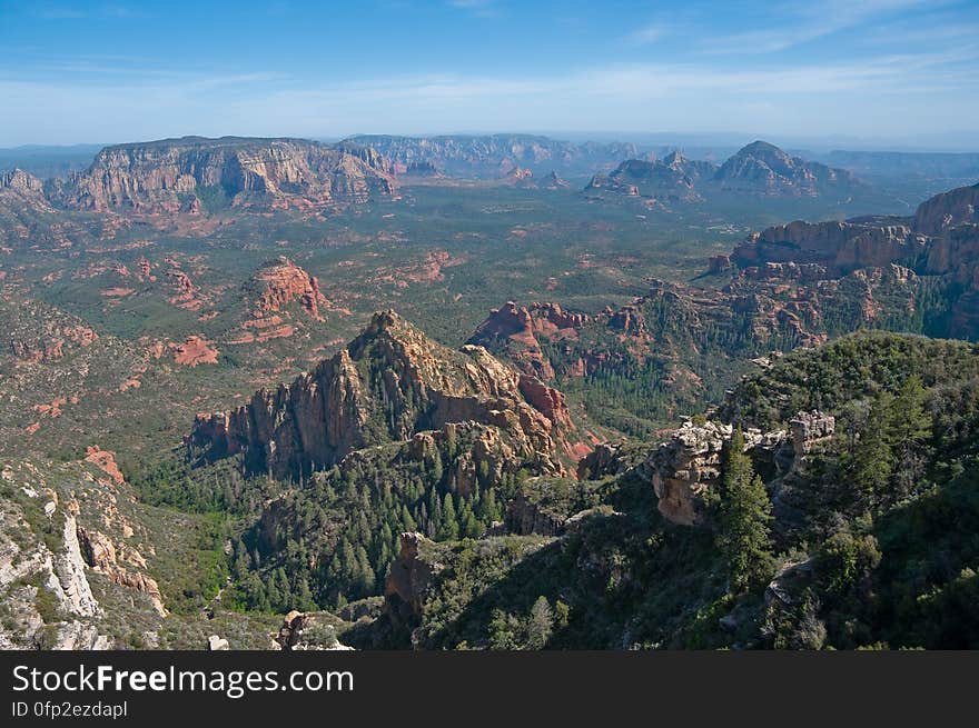 View into Secret Canyon from Little Round Mountain. We headed out of Flagstaff down Woody Mountain Road for a week of camping and day hiking around the Rattlesnake Mesa area. The area is north of Sedona&#x27;s Secret Canyon, on top of the Mogollon Rim. There are several trails, mostly unmaintained, heading along or off the edge of the Rim. For the first day&#x27;s hike, we headed for FS Trail #9, which heads across Little Round Mountain and along the Rim around South Pocket... Read the blog entry for this hike