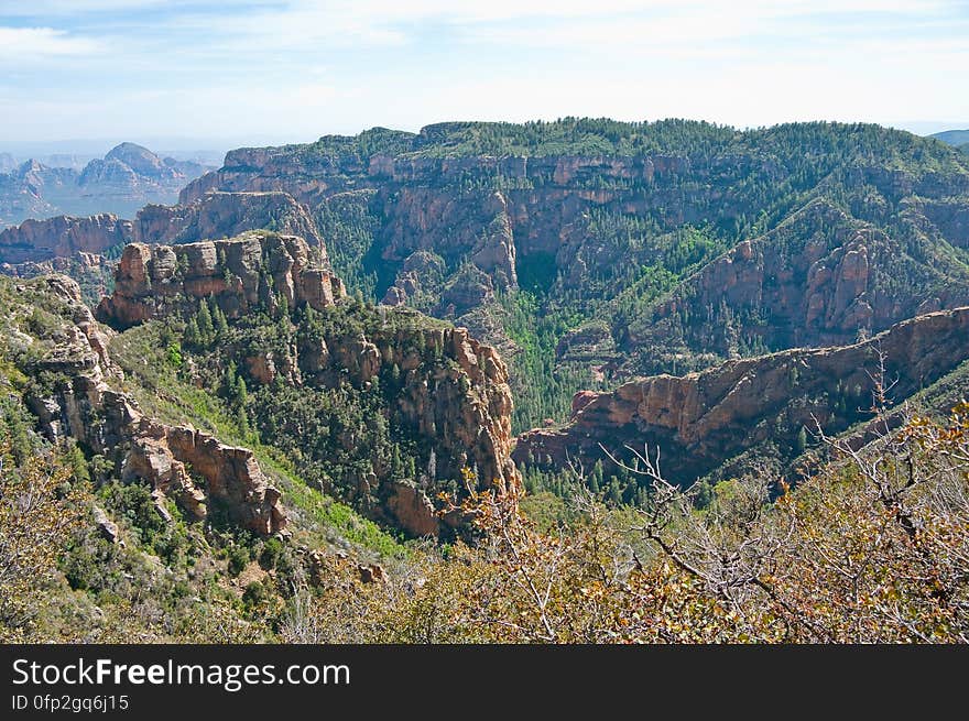 View into Secret Canyon from Little Round Mountain. We headed out of Flagstaff down Woody Mountain Road for a week of camping and day hiking around the Rattlesnake Mesa area. The area is north of Sedona&#x27;s Secret Canyon, on top of the Mogollon Rim. There are several trails, mostly unmaintained, heading along or off the edge of the Rim. For the first day&#x27;s hike, we headed for FS Trail #9, which heads across Little Round Mountain and along the Rim around South Pocket... Read the blog entry for this hike