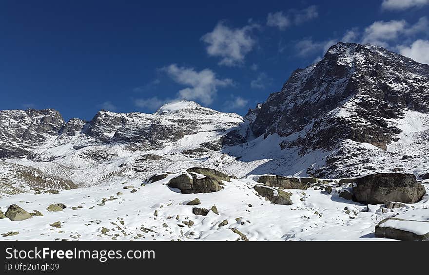 A rocky mountain peak in winter.