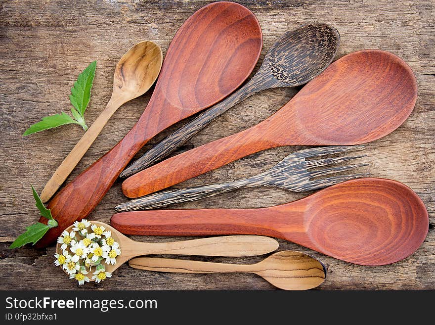 Wooden spoons on wooden background. Wooden spoons on wooden background.