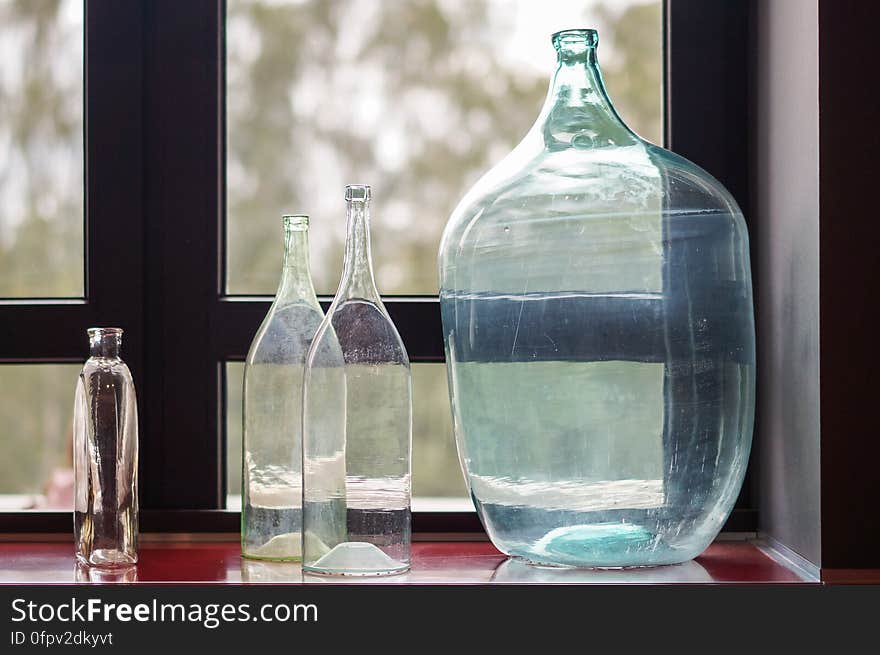 Glass bottles on the window. Glass bottles on the window