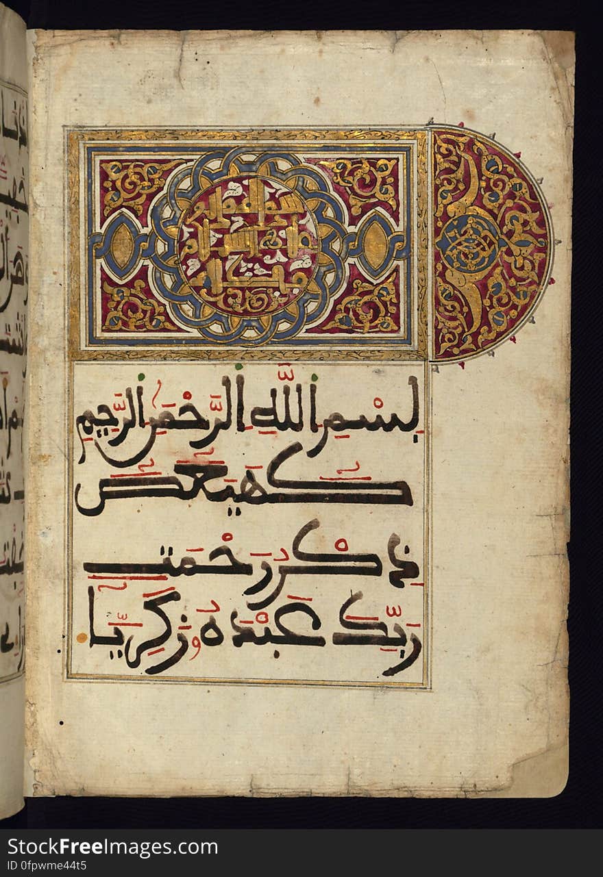 A fragment of the Koran &#x28;Qur&#x27;an&#x29; covering the chapters 19 &#x28;Mariam&#x29; through 23 &#x28; al-Muʾminūn&#x29; written on Italian paper in a large Maghribi script, with vocalization in red ink, in the 12th AH / 18th CE century. Shown here is the illuminated incipit page with a headpiece carrying the chapter heading &#x28;Maryam&#x29; in a decorative New Abbasid Style &#x28;&#x27;broken cursive&#x27;&#x29; in the central medallion in gold. See this manuscript page by page at the Walters Art Museum website: art.thewalters.org/viewwoa.aspx?id=38427. A fragment of the Koran &#x28;Qur&#x27;an&#x29; covering the chapters 19 &#x28;Mariam&#x29; through 23 &#x28; al-Muʾminūn&#x29; written on Italian paper in a large Maghribi script, with vocalization in red ink, in the 12th AH / 18th CE century. Shown here is the illuminated incipit page with a headpiece carrying the chapter heading &#x28;Maryam&#x29; in a decorative New Abbasid Style &#x28;&#x27;broken cursive&#x27;&#x29; in the central medallion in gold. See this manuscript page by page at the Walters Art Museum website: art.thewalters.org/viewwoa.aspx?id=38427