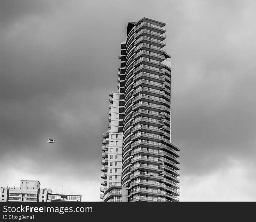 A black and white photo of a modern tall office building.