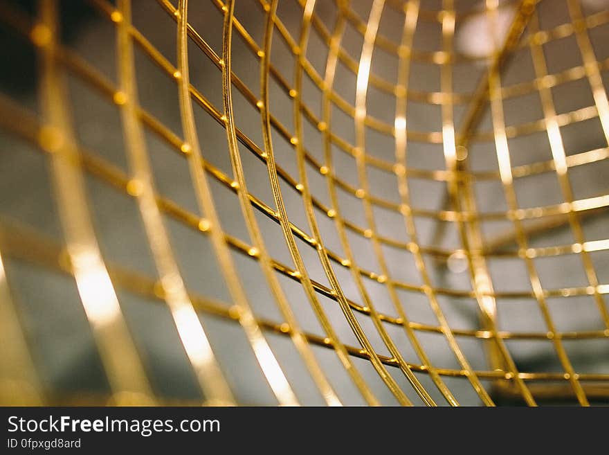 A close up of a golden mesh. A close up of a golden mesh.