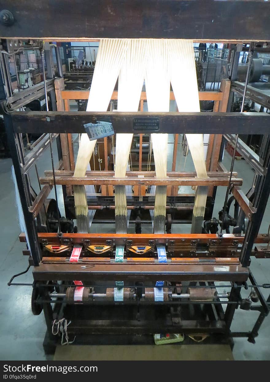 A ribbon loom. Programmable using punch cards and used for complex designs such as labels. A ribbon loom. Programmable using punch cards and used for complex designs such as labels.