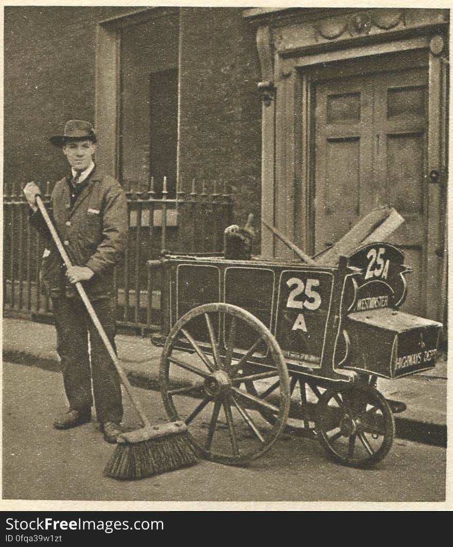 London, 1920s Photogravure by Donald Macleish from Wonderful London by St John Adcock, 1927. From the section entitled Public servants of the London streets: The road-sweeper, fully fledged, with a push-cart bearing the cognizance of an ancient and once royal city. It is to be wondered how much the decline of the horse traffic has affected the demand for both the road-sweeper and the scavenger boy. London, 1920s Photogravure by Donald Macleish from Wonderful London by St John Adcock, 1927. From the section entitled Public servants of the London streets: The road-sweeper, fully fledged, with a push-cart bearing the cognizance of an ancient and once royal city. It is to be wondered how much the decline of the horse traffic has affected the demand for both the road-sweeper and the scavenger boy.