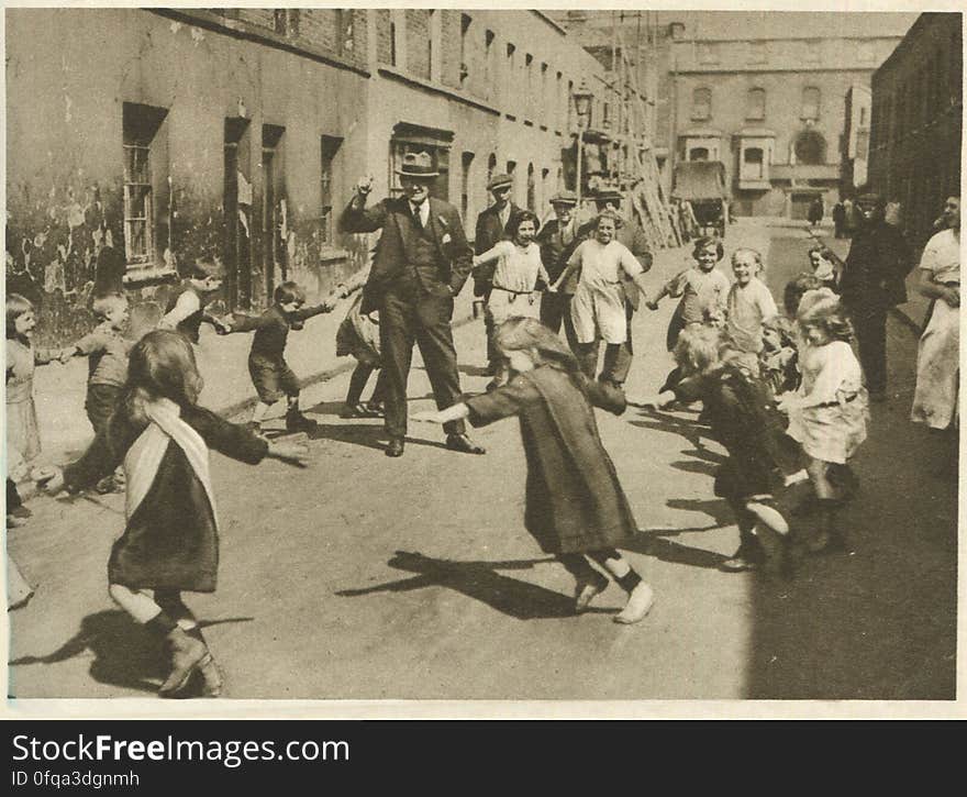 somewhere in Poplar, London Photogravure by Donald Macleish from Wonderful London by St John Adcock, 1927. Children playing a skipping game in an East End street. somewhere in Poplar, London Photogravure by Donald Macleish from Wonderful London by St John Adcock, 1927. Children playing a skipping game in an East End street.