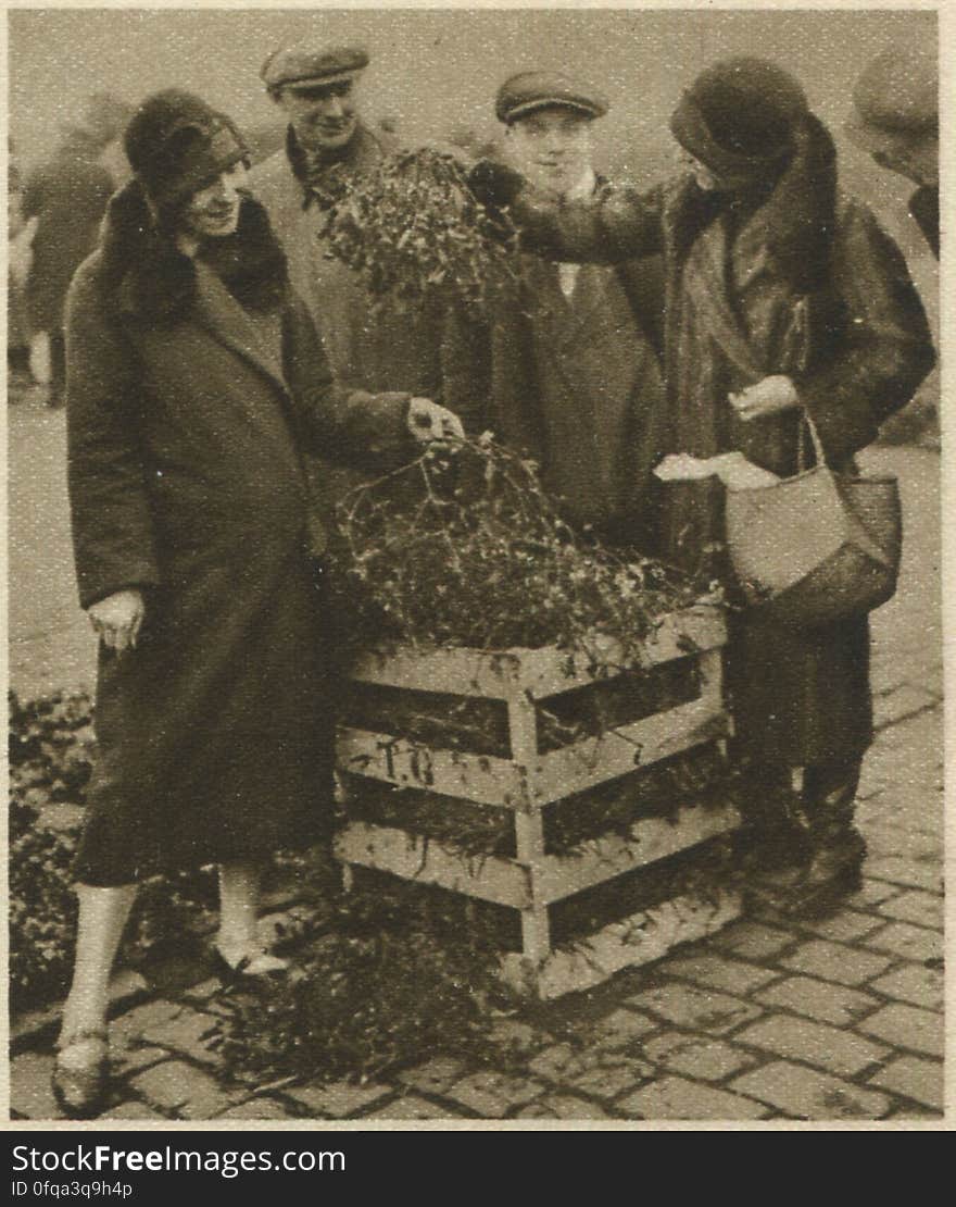 Caledonian Market, London Photogravure by Donald Macleish from Wonderful London by St John Adcock, 1927. Both buyers and sellers are showing the conventional amused embarrassment which is associated with mistletoe. More at www.wonderfullondon.tumblr.com/