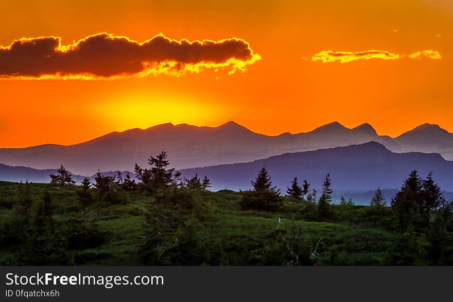 Scenic View of Mountains Against Sky at Sunset