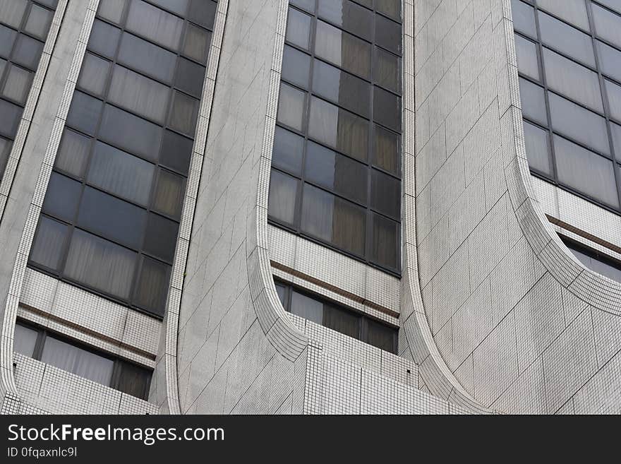 Part of the facade of a modern high rise building.