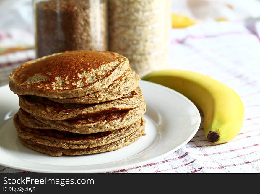 Pile of pancakes for breakfast with ripe banana. Pile of pancakes for breakfast with ripe banana.