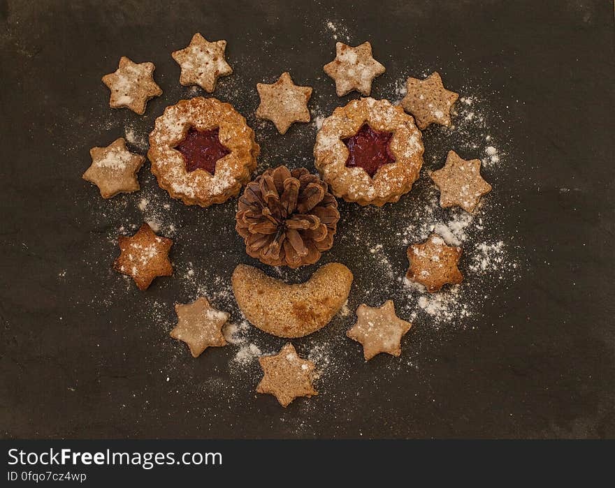 Christmas gingerbread cookies in a heart shape with a pinecone in the middle. Christmas gingerbread cookies in a heart shape with a pinecone in the middle.