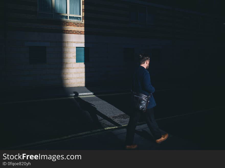 Person in Blue Blazer and Black Pants Walking