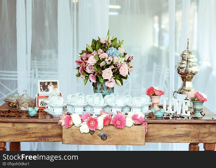 A table with decorations for a wedding party. A table with decorations for a wedding party.