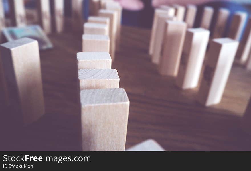 Wood blocks set a domino effect. Wood blocks set a domino effect.