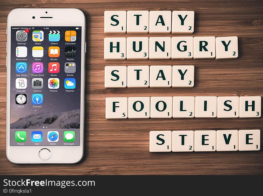 An iPhone with the Steve Jobs quote "Stay hungry stay foolish".