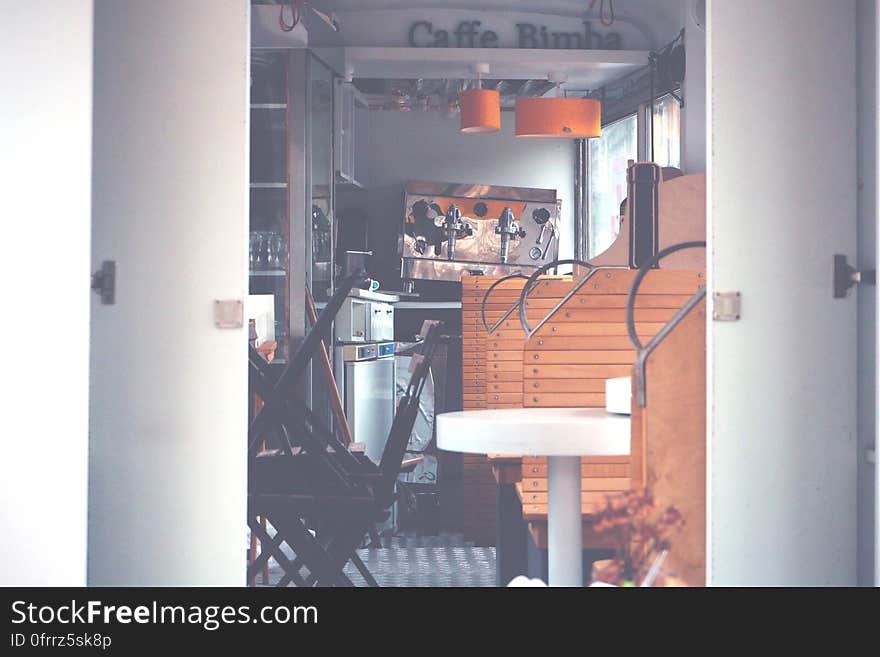 Interior of empty bar or cafe with tables in sunlight. Interior of empty bar or cafe with tables in sunlight.