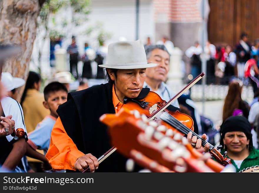 Man Playing the Violin on the Street