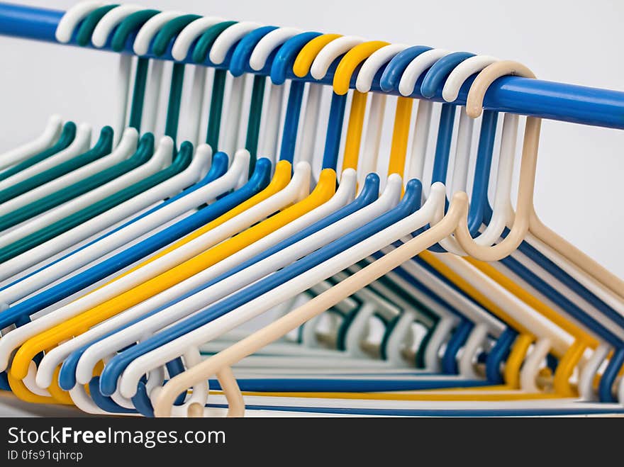 White Blue Yellow and Green Plastic Clothes Hanger