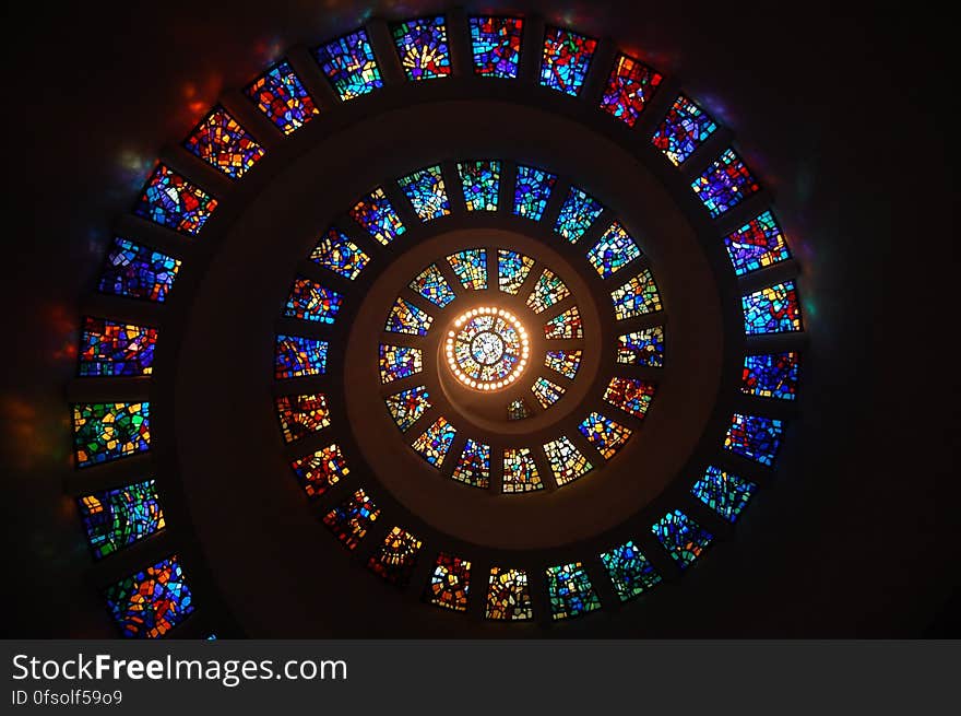 Worms Eye View of Spiral Stained Glass Decors Through the Roof