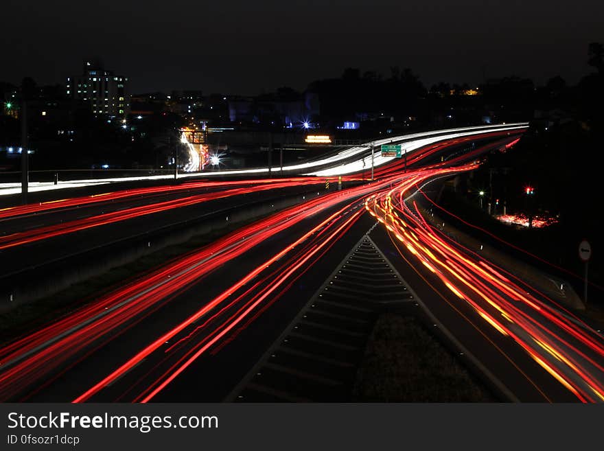 A long exposure of a street with light streaks at night. A long exposure of a street with light streaks at night.