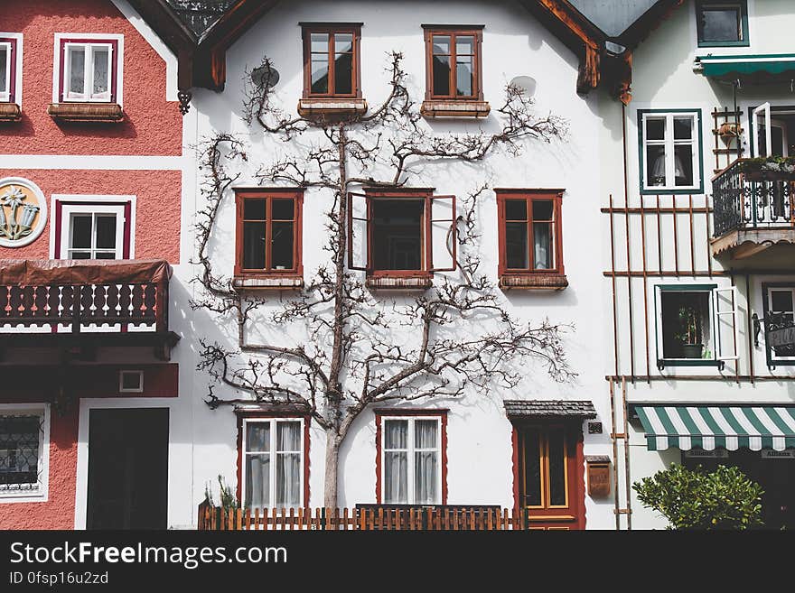 A white three-story house in Hallstatt, Austria. A white three-story house in Hallstatt, Austria.