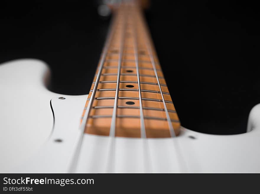 White and Brown Electric Bass Guitar