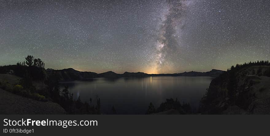 Starry night sky over Crater Lake National Park in Oregon, USA.