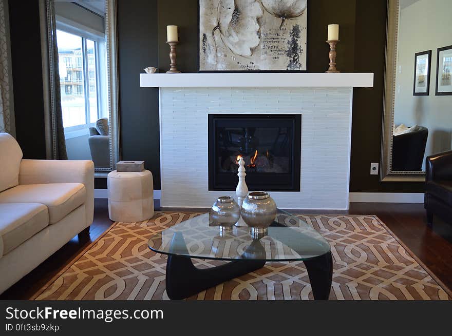 Fashionable furnishing inside contemporary living room with fireplace in apartment. Fashionable furnishing inside contemporary living room with fireplace in apartment.