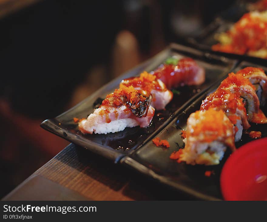 Plates of Japanese nigiri sushi with seafood. Plates of Japanese nigiri sushi with seafood.