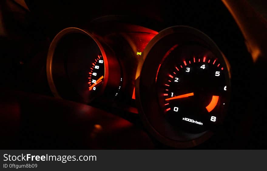 Speed and odometer illuminated on car dashboard at night. Speed and odometer illuminated on car dashboard at night.