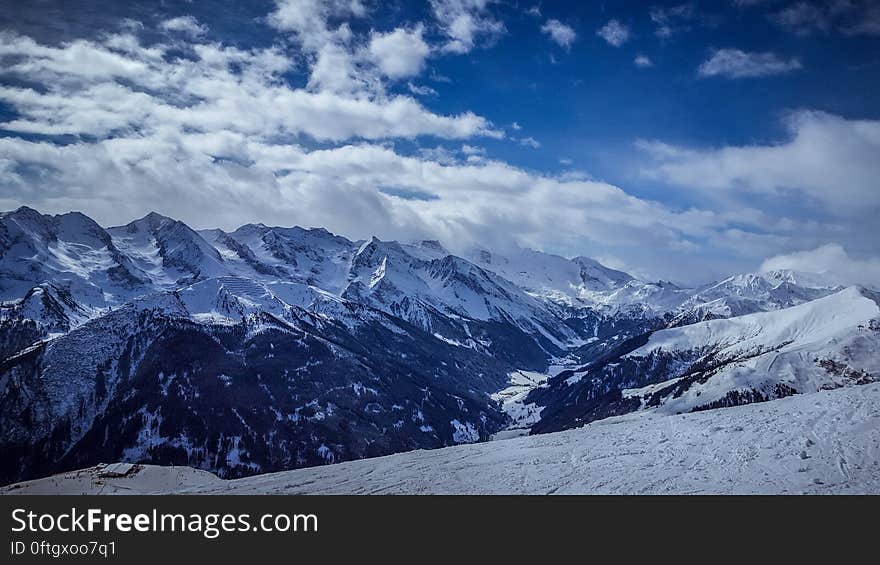 A landscape with snowy mountains.