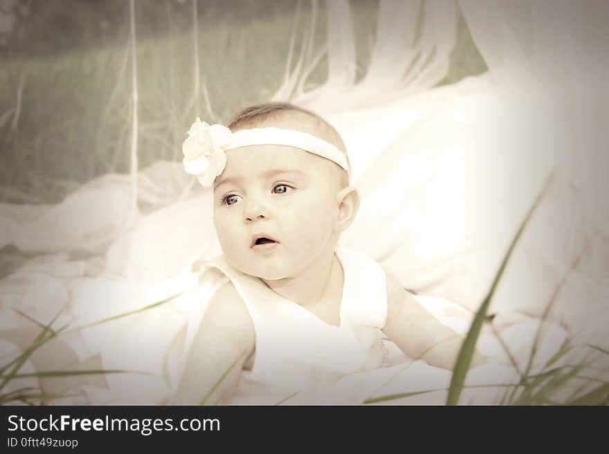 Baby in White Tank Dress and Headband