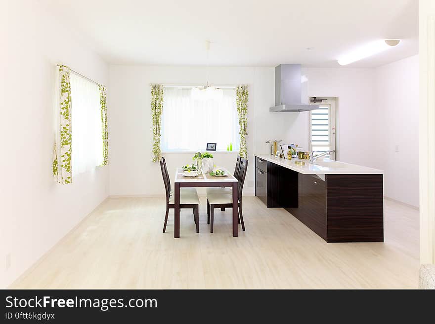 Interior of contemporary apartment kitchenette and dining room. Interior of contemporary apartment kitchenette and dining room.