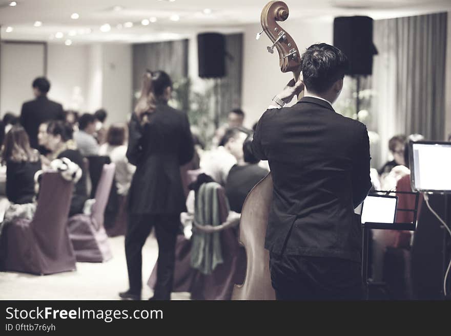 A orchestra playing in a restaurant for a party. A orchestra playing in a restaurant for a party.