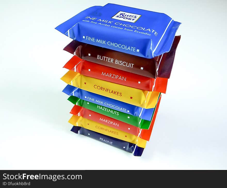 A stack of miniature chocolates with different flavors.