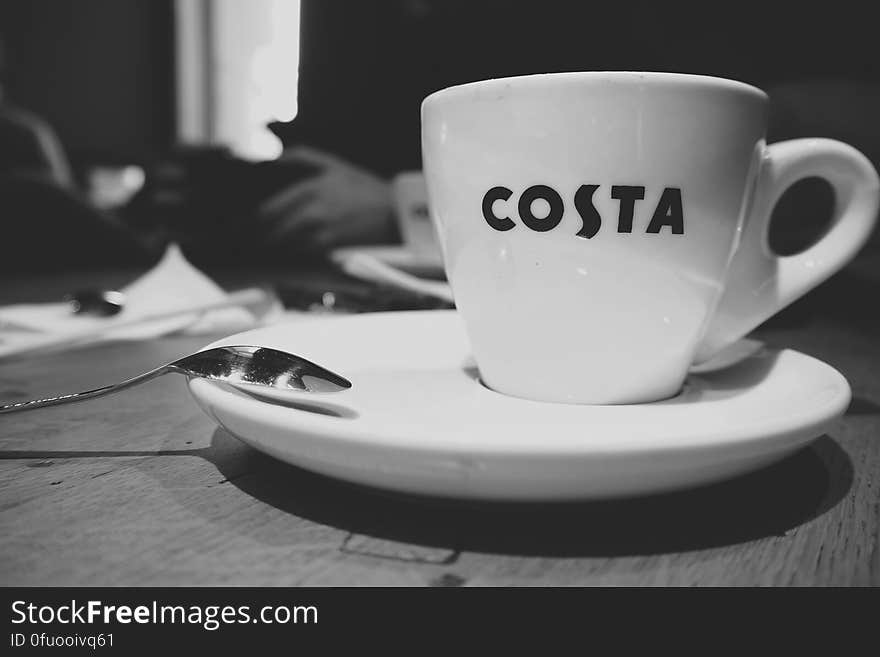 A black and white image of a cup of coffee.