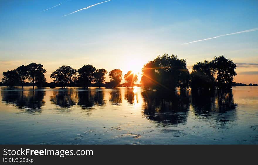 Scenic View of Lake Against Sky during Sunset