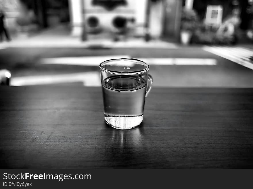 Gray Scale Photo of Glass With Water