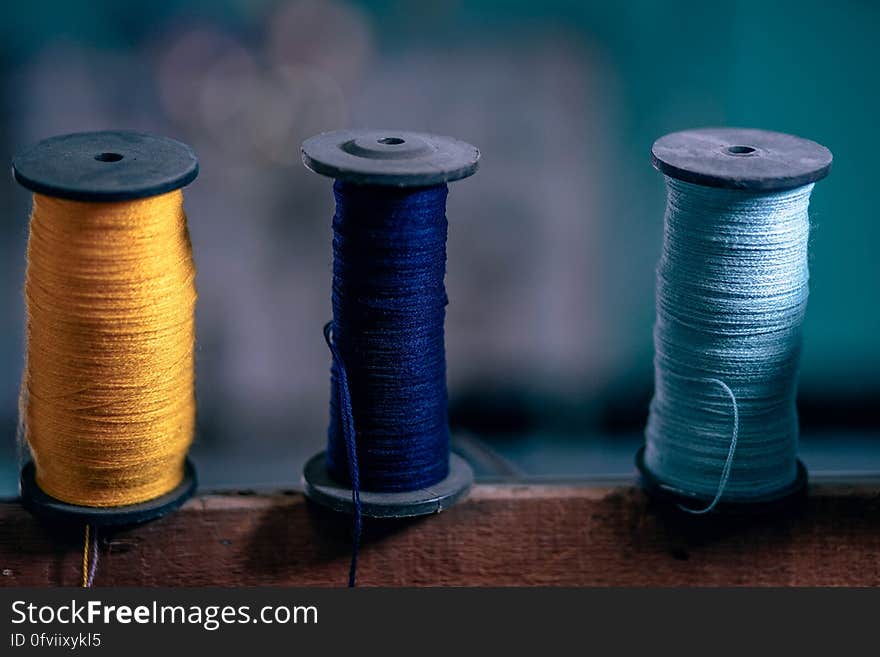 Three spools with colorful strings. Three spools with colorful strings.