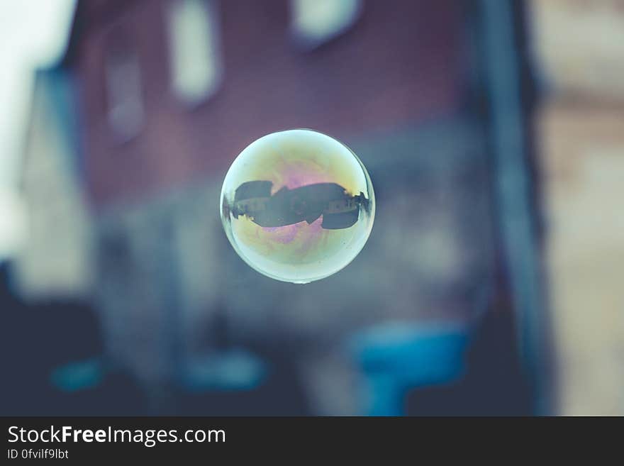 A soap bubble floating in the air.